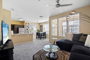 a living room with a couch and a table at Luxury 2BR/2BA! 5 MIN to Disney! in Anaheim