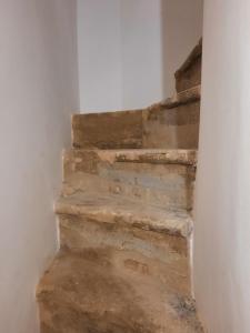 a set of stone stairs in a room at Il sogno in Santo Stefano di Sessanio