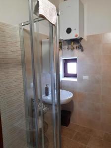 a bathroom with a shower and a sink at Il sogno in Santo Stefano di Sessanio