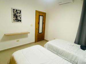 Postel nebo postele na pokoji v ubytování Apartamento Próximo Playa Caleta