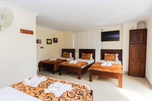 Letto o letti in una camera di Hotel Verony Guatape