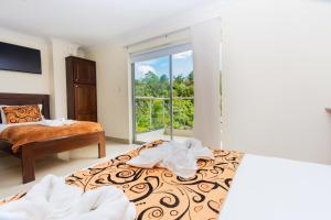 Letto o letti in una camera di Hotel Verony Guatape