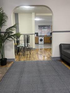 a living room with a couch and a table at Charlesworth House in Crewe