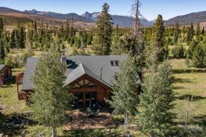 an aerial view of a home with mountains in the background at Sun Valley Cabin in Grand Lake