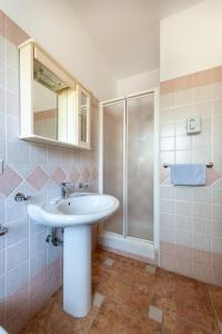 a bathroom with a sink and a shower at Residence Martino - Casa Vacanze in Castelnuovo Cilento