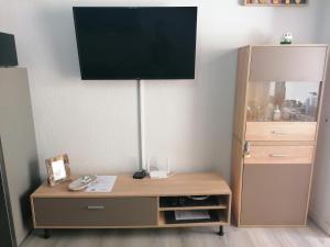 A television and/or entertainment centre at Castillo Mar- Casa Martini