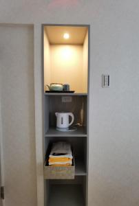 a closet with a shelf with a tea kettle on it at belle via tokyo - Vacation STAY 60795v in Tokyo