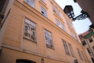 a building with windows on the side of it at Astronomical Clock Suite by Ruterra in Prague