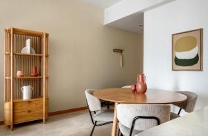 a dining room with a table and chairs at 1Br + 1Bath Lovely apartment! in Singapore
