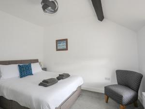 Ένα ή περισσότερα κρεβάτια σε δωμάτιο στο 2 Morfa View