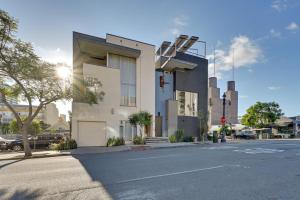 a building on the corner of a street at Bright San Diego Vacation Rental in Little Italy in San Diego