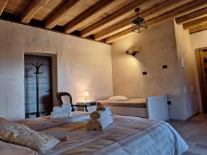 a bedroom with two beds in a room at Agriturismo La Pina in Tarzo