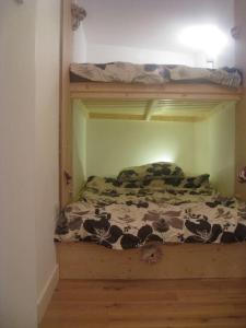 a bedroom with a bunk bed with a cow print at The Nook, Studio Apartment, South Queensferry in Queensferry