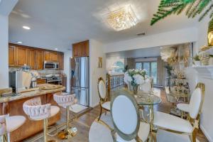 a kitchen with a table and chairs in a room at Dreams of Paradise Luxury Home with Pool! 