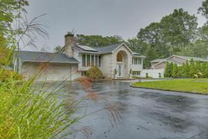 a house in the rain with a driveway at Dreams of Paradise Luxury Home with Pool! 