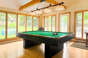 a large living room with a pool table at Our Home on a Hill in Bethel