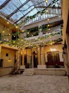 a building with lights hanging from the ceiling at Hyba Pod Hostel & Hotel in Dubai