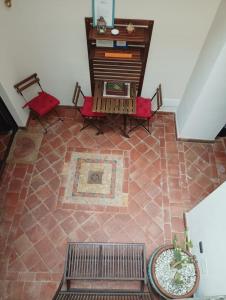 an overhead view of a living room with a bench and chairs at B&b Luna in Syracuse