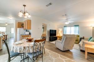 a living room with a dining room table and a kitchen at Weeki Wachee Vacation Rental about 13 Mi to the Ocean! in Spring Hill