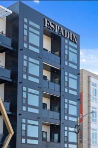 a building with a sign on the side of it at Southwestern Charm | Espadin LoHi in Denver
