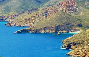 a large body of water with a bunch of mountains at Ecoturismo Cabo Tiñoso in Murcia +99 photos