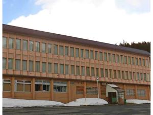 a large building with snow in front of it at Asakusa Sanso - Vacation STAY 52021v in Uonuma