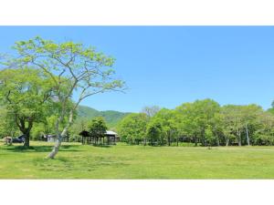 a park with a tree and a gazebo at Asakusa Sanso - Vacation STAY 52021v in Uonuma
