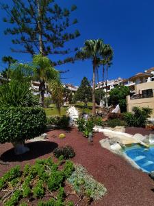 A garden outside Strelitzia Apartment - ocean view & heated pool