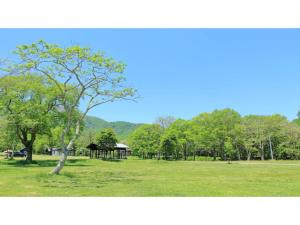 a park with a tree and a gazebo at Asakusa Sanso - Vacation STAY 51996v in Uonuma