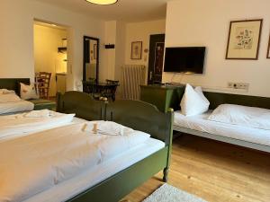 Ein Bett oder Betten in einem Zimmer der Unterkunft Haus Edelweiss