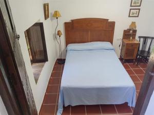 เตียงในห้องที่ Casa en el valle de GuainosAltos