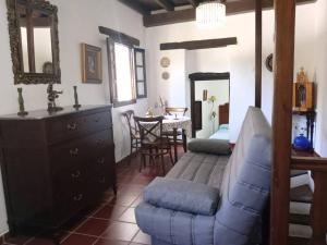 a living room with a couch and a table at Casa en el valle de GuainosAltos in Adra