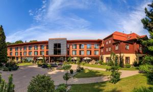 an exterior view of a building with a courtyard at Hotel Zochova Chata - Adult friendly in Modra