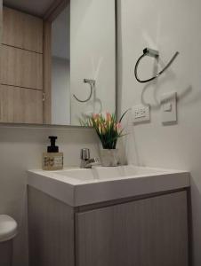 a bathroom with a sink and a mirror at Apartaestudio Centro Historico Bogota in Bogotá