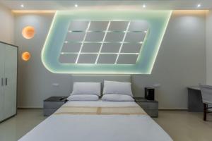 a bedroom with a large bed and a large skylight at Hyper Lodge Termini GuestHouse in Rome +63 photos