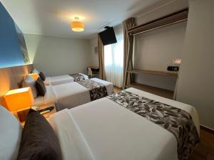 Postel nebo postele na pokoji v ubytování Hotel El Tambo 2