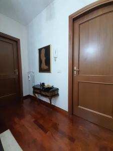 an empty room with a door and a table at Michelangelo-Sunset-Villa in Santa Marinella