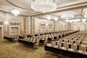 a large room with rows of tables and chairs at Waldorf Astoria Jerusalem in Jerusalem +154 photos