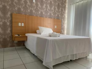 Postel nebo postele na pokoji v ubytování FLORENÇA PALACE HOTEL