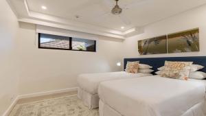Postel nebo postele na pokoji v ubytování AZURE 187 Port Douglas