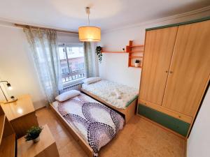 Postel nebo postele na pokoji v ubytování El Reloj del Pilar ComoTuCasa