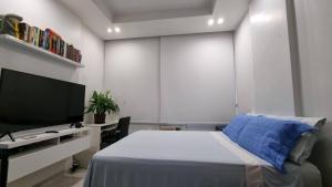 Кровать или кровати в номере Apartamento Temporada Copacabana