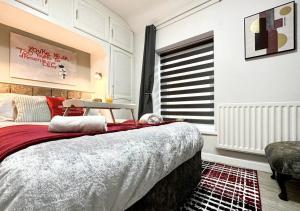 a bedroom with a large bed and a window at Joyful Jungle Jewel w/Balcony & Foozeball-Ferndale 