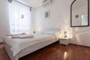 Cama o camas de una habitación en Apartments by the sea Dubrovnik - 20316