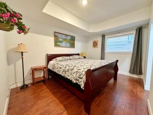 a bedroom with a bed and a window at Oasis in Victoria