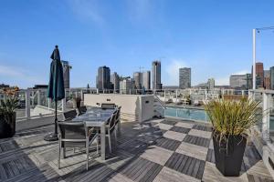 a patio with a table and chairs on a roof at Luxury downtown loft 1 bedroom in Los Angeles
