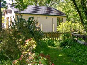 a small house with a fence and a garden at The Swallows in Appledore