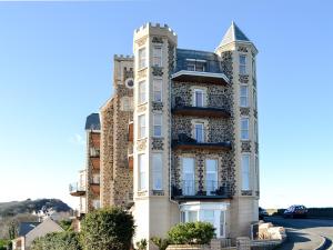 an apartment building with a turret at Apartment 6 in Ilfracombe
