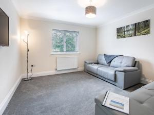 a living room with a couch and a tv at Dawson Park 10 - Uk12669 in Mablethorpe