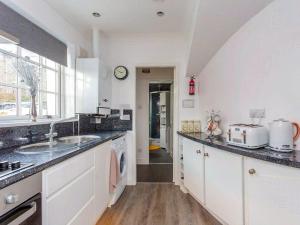 a kitchen with a sink and a counter top at Toll House in Berwick-Upon-Tweed